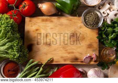 Assortment Of Vegetables, Herbs And Spices On Wooden Table. Top View. Copy Space
