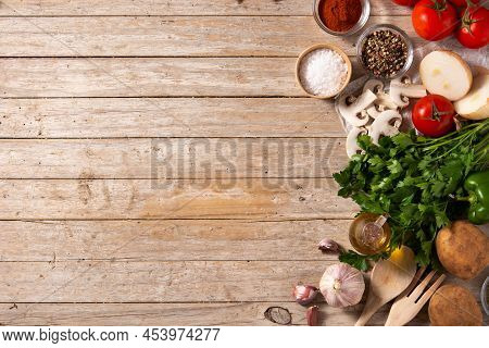 Assortment Of Vegetables, Herbs And Spices On Wooden Table. Top View. Copy Space