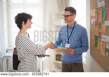 Job Centre Employee Meeting Young Woman Searching For Job.