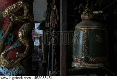 Bangkok, Thailand - Apr 29, 2022 : Sculptured Golden Dragons Red Pillar And Traditional Old Green Ir