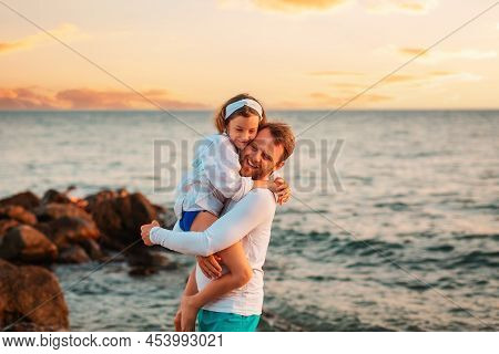 Father's Day. Portrait Of Embrasing Happy Father And Daughter Have A Funny Time. On The Background S