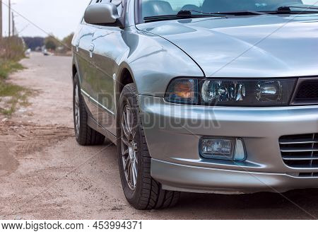 Lviv Ukraine - 05 02 2022: Mitsubishi Motors. Car Mitsubishi Galant Fragment Front View Of Headlight