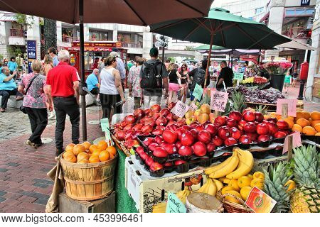 Boston, Usa - June 9, 2013: People Shop At A Fruit Market Stall In Boston. Boston Is The Capital And