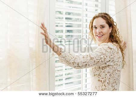 Smiling Woman Near Window