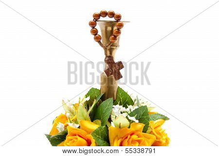 Orange Flowers with Green Sheets and Candle Holder on white background