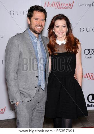 LOS ANGELES - DEC11:  Alexis Denisof & Alyson Hannigan  arrive to Women in Entertainment Breakfast 2013  on December 11, 2013 in Hollywood, CA                