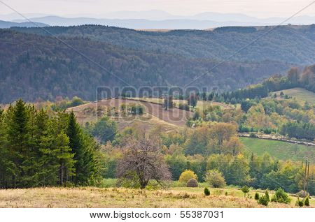 Viewpoint on a landscape of mount Bobija, peaks, hills, meadows and colorful forests
