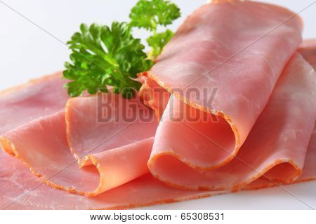 detail of oven roasted ham decorated with fresh parsley 