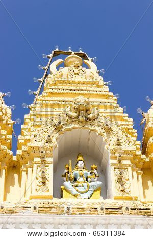 close up view of Goddess Parvati statue at the entrance wall of temple