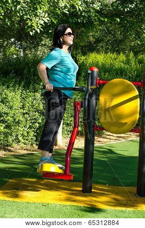 Woman Working Out On A Air Swinger Machine Station Outdoor