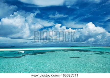 Beautiful island beach with sandspit at Maldives