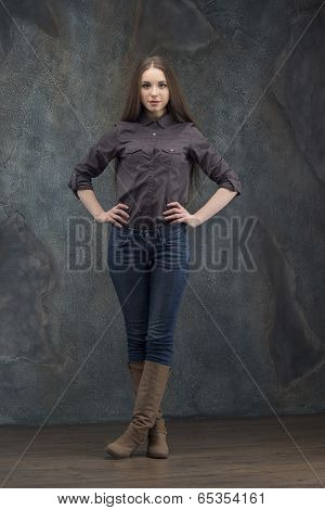 Woman standing on dark background