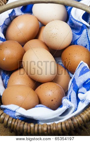 Basket Of Organic Freerange Eggs With Blue And White Cloth