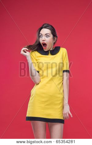 Woman half length on red background