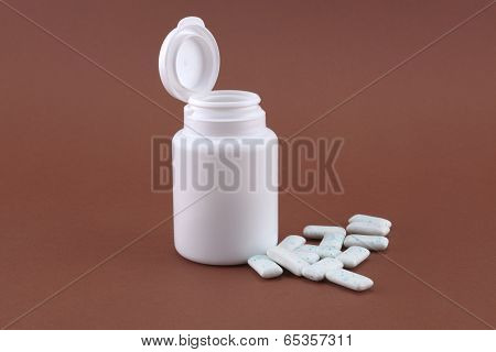 White box with chewing gum on the brown background