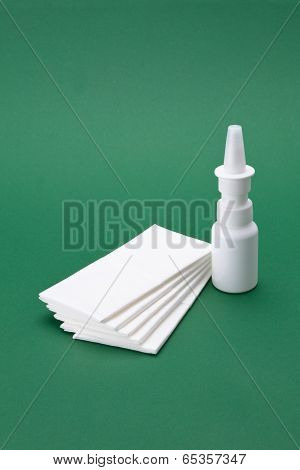 Nasal spray with white cloths bag in the green background