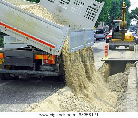 Truck In The Excavation After Laying Of Underground Electric Cables