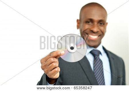 Handsome Businessman Holding A Cd