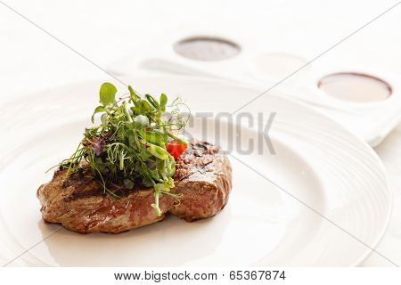 grilled steak with herbs
