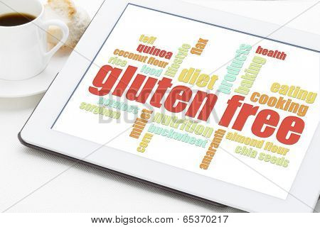 gluten free cooking word cloud on a digital tablet with a cup of coffee