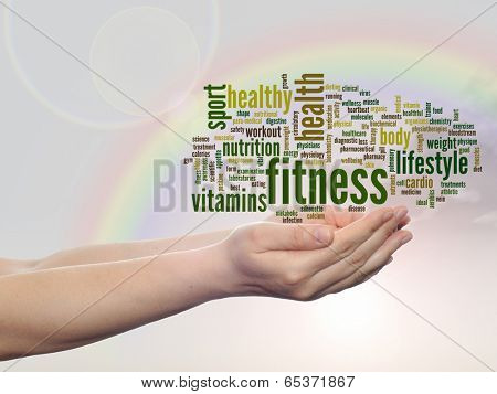 Concept or conceptual abstract fitness and health word cloud man hand, rainbow sky background
