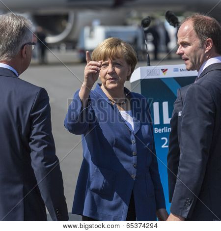BERLIN, GERMANY - MAY 20, 2014: German Chancellor Angela Merkel (C) during open the International aviation and space exhibition ILA-2014.