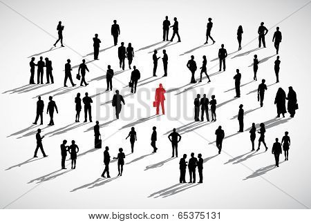 An individual businessman standing admist the crowd of business people.