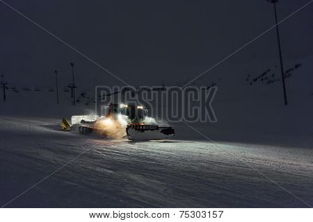 Snowcat Cleaning Slope In Night At Snow Resort Of Gudauri, Georgia