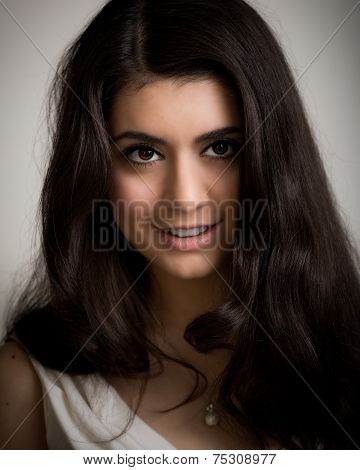 Portrait Of A Beautiful Smiling Young Brunette Woman