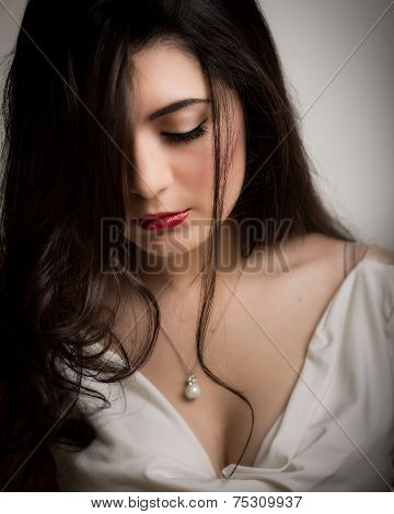 Beautiful Young Brunette Woman Looking Down