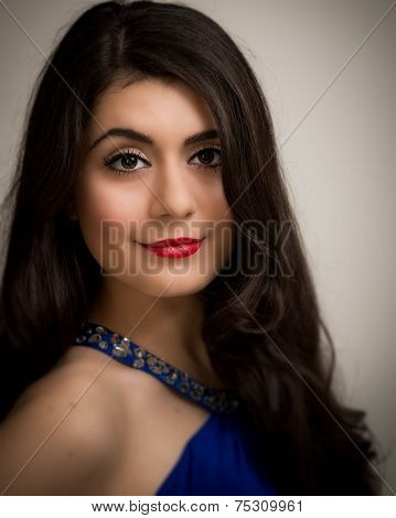 Portrait Of A Beautiful Smiling Young Brunette Woman