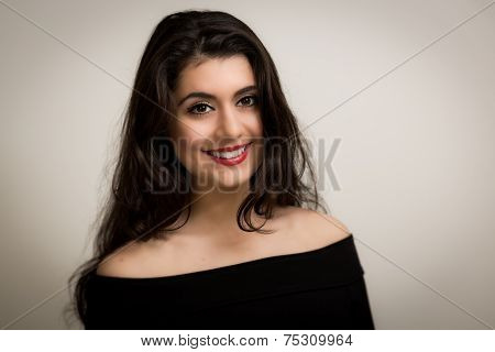 Portrait Of A Beautiful Smiling Young Brunette Woman