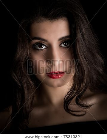 Portrait Of A Beautiful Young Brunette Woman Looking Into The Camera