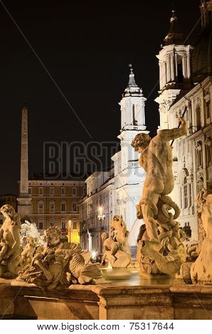 Beautiful Fountain of Neptune on Piazza Navona by night in Rome, Italy