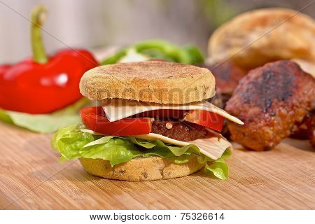 Homemade cheeseburger with a fresh lettuce and red pepper