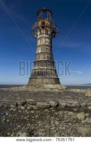 Ruined Derelict Lighthouse, Whiteford Sands, Gower Peninsula, South Wales. Blue Sky.
