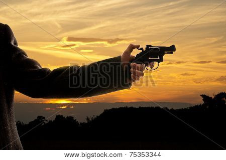 Silhoutte Of A Man With A Handgun