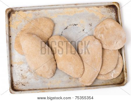 Loaves of traditional Egyptian homemade brown pita bread, fresh from the oven. called aish baladi