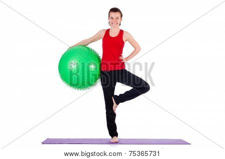 Young woman exercising with swiss ball
