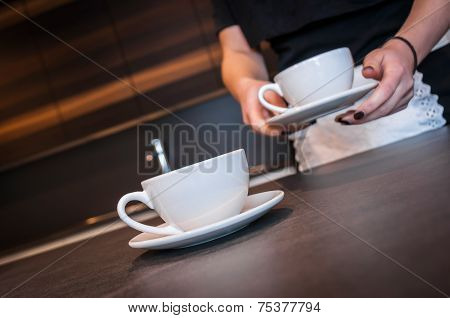 Waitress preparing coffee