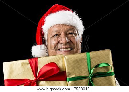 Smiling Aged Man Peeking Across Two Golden Gifts