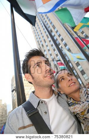 Couple standing by the Rockfeller center in New York City