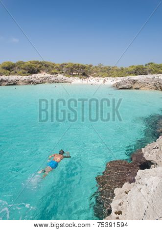 Snorkeling In A Beautiful Cala In Minorca.