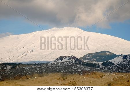 clouds on the snowy volcano Etna National Park, Sicily
