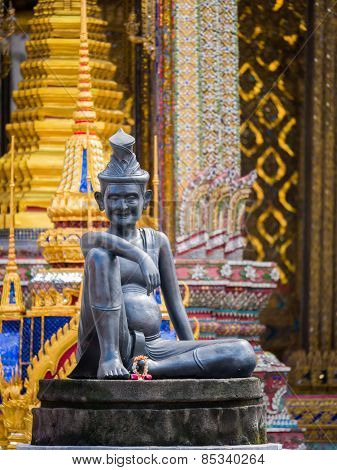 statue of hermit located in front of temple, wat phra keaw, Bangkok Thailand