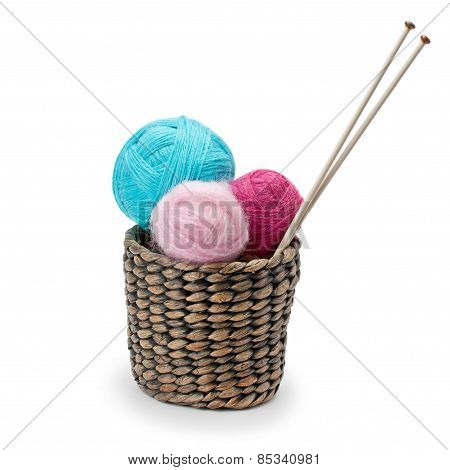 Yarn And Knitting Needles Arranged In A Basket