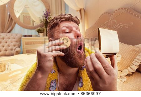 adult strange man powders himself