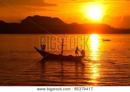 Traditional Fisherman Long Tailed Boat In Koh Phitak Island, Thailand At Sunset.