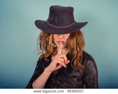 Young Woman With Finger On Her Lips