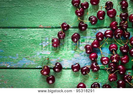 Cherry On Old Rustic  Wooden Background.